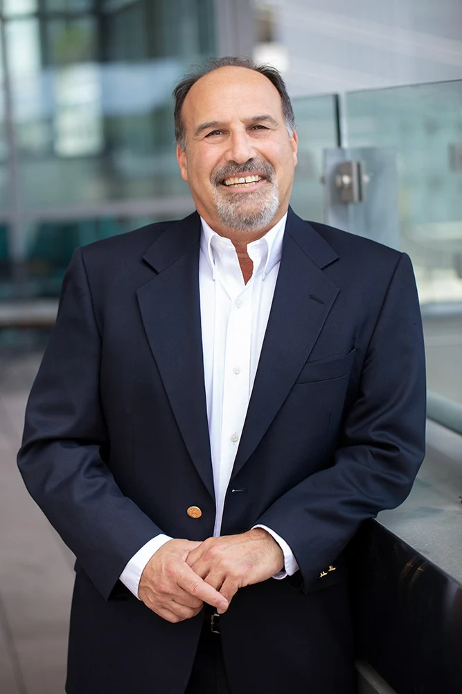 Joel Goobich in a jacket without a tie